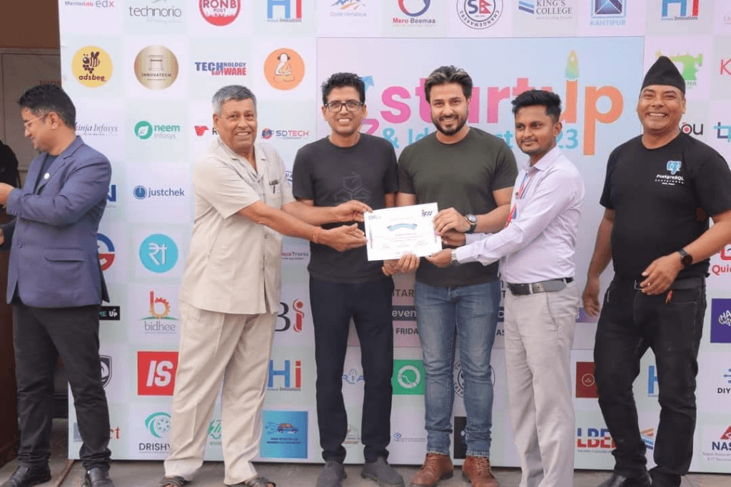 Receiving Award at Nepal Startup & Idea Fest 2023